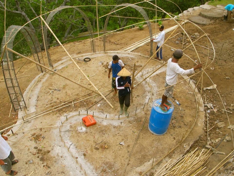 Bamboo dome framework laid out in a circle, seen from above