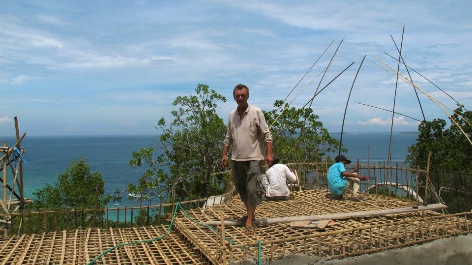 Craftsmen weaving the bamboo lattice roof