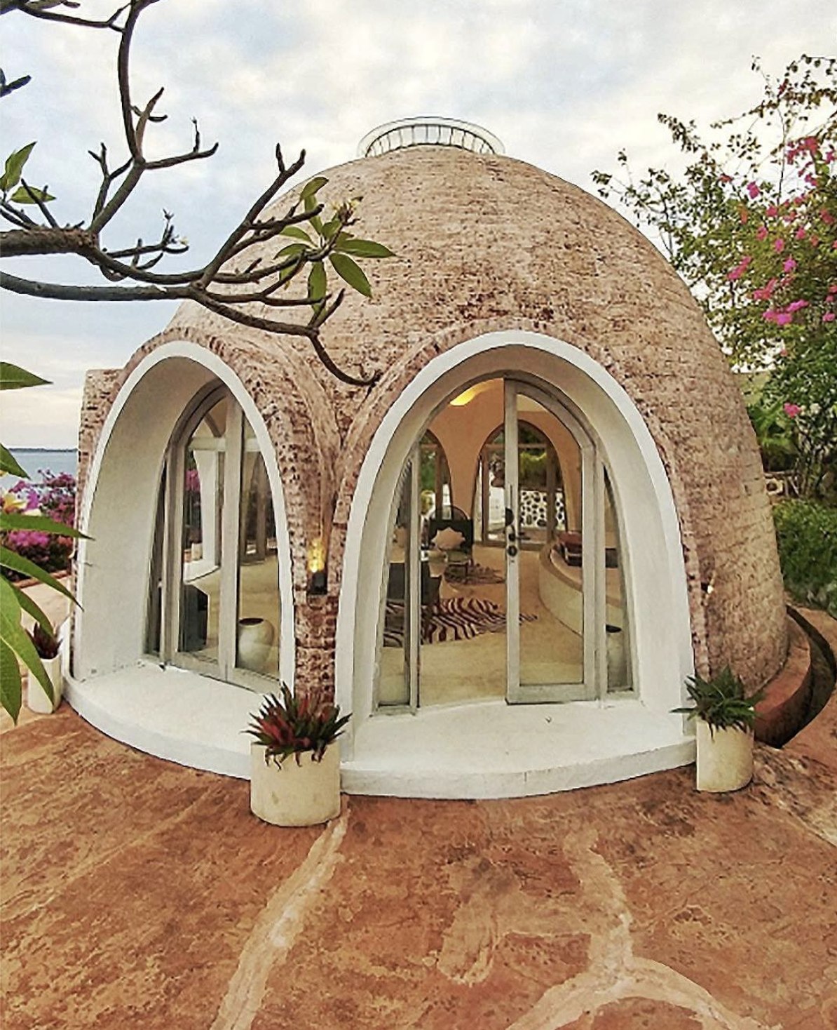 Original handcrafted brick dome at Mentigi Bay with arched glass doors